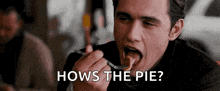 a man is eating a piece of food with a fork and the words hows the pie above him