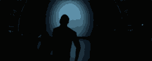 a dark room with a blue light coming out of the corner