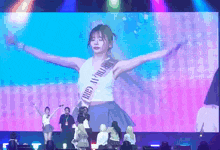 a girl is wearing a sash that says birthday girl on it