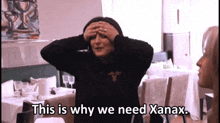 a woman covering her eyes with her hands and the words " this is why we need xanax " next to her
