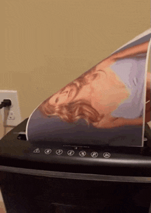 a paper shredder with a picture of a woman on it