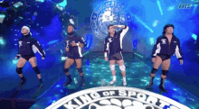 a group of men are standing in front of a logo that says king of sport