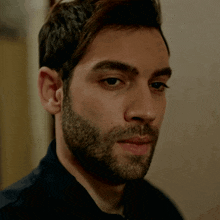 a close up of a man 's face with his eyes closed