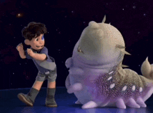 a boy is standing next to a purple and white cartoon character
