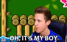 a man says oh it 's my boy in front of a video game background