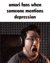 a man wearing headphones and glasses is making a funny face while someone mentions depression .