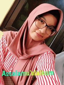 a woman wearing glasses and a hijab with the words assalamualaikum written on the bottom