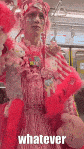 a girl in a pink dress is holding a stuffed animal and the word whatever is on the bottom