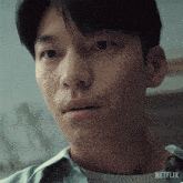 a close up of a man 's face with the word netflix on the bottom right
