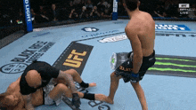 a fighter in a ufc ring with a bud light advertisement in the background