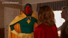 a man in a superhero costume stands next to a woman in a red cape
