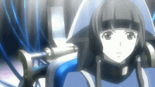 a girl with black hair and a white hat is sitting in a blue chair
