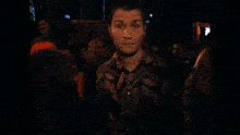 a blurry picture of a man 's face with a woman behind him