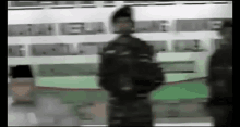 a blurry picture of a man standing in front of a building