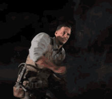 a man wearing a vest with blood on it is running