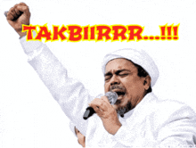 a man singing into a microphone with a fist in the air and the words takbirrr written above him