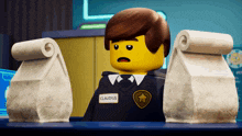 a lego police officer named claudius holds two bags of food