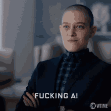 a woman in a suit says fucking a