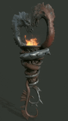 a statue of a dragon with a flame in it