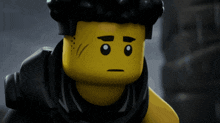 a close up of a lego figure with a serious expression