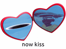 a heart shaped mirror with the words now kiss on the bottom
