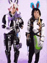 a man in a bunny costume is standing next to another man in a rabbit costume