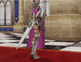 a woman in armor holds a large sword in a room
