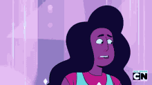 a cartoon character with purple hair and a blue shirt is standing in front of a purple background .