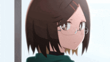 a close up of a girl wearing glasses and a green sweater