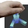 a close up of a person 's hand holding a blue cube .