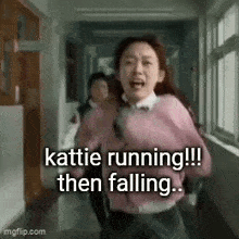 a girl in a pink sweater is running down a hallway in a school .