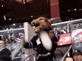 a mascot wearing a jersey that says los angeles