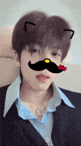 a young man with a cat ear and a mustache