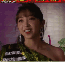 a close up of a woman 's face with the words secret number on the bottom right