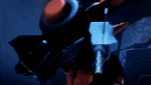 a robot with a red button on it 's back