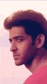 a close up of a man 's face with his eyes closed