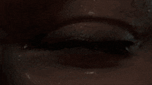 a close up of a person 's eye with mascara on it .
