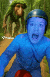 a woman in a blue shirt is riding a bike with a troll in the background and the words viggle.ai on the bottom