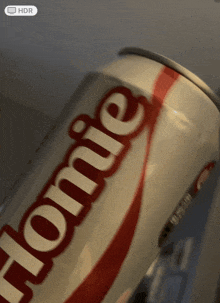 a close up of a coca cola can that says " home "