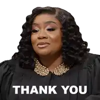 a woman in a graduation cap and gown says " thank you "