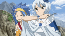 a girl in a white cape is holding a silver key
