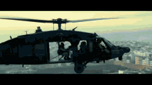 black hawk down helicopter soldiers town sky