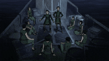 a group of people are sitting in a circle with one man standing in the middle