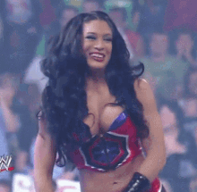 a woman in a red and purple outfit is smiling