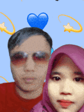 a man wearing sunglasses and a woman wearing a purple head scarf pose for a picture