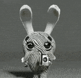 a black and white zebra holding a mug that says ' zebra & skull ' on it