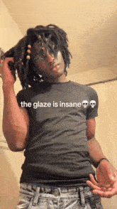 a man with dreadlocks is wearing a black shirt that says the glaze is insane on it
