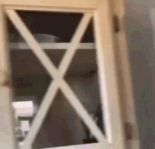 a close up of a door with a cross on it