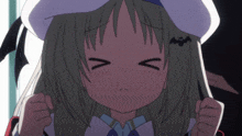 a girl with a bat on her ear is making a funny face