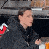 a man sitting at a table with a glass of milk in front of him